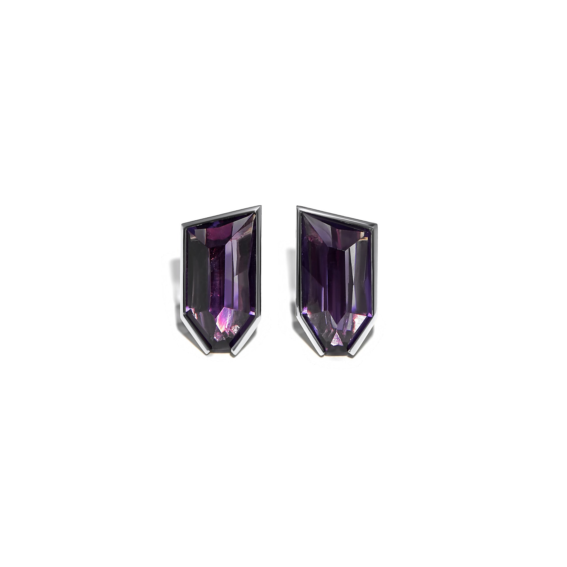 The centerpiece of these earrings is the two unique fancy-cut dark amethyst gemstones. The amethysts are carefully selected for their exceptional color and clarity, showcasing a deep, rich hue that is both captivating and enchanting. The fancy-cut shape adds a modern twist to the classic gemstone, creating a dynamic and eye-catching appeal.